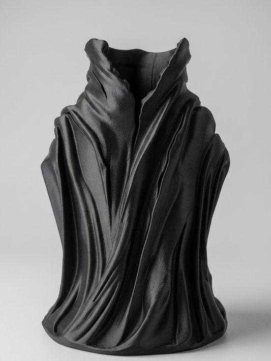 Black sculpture on a gray background
