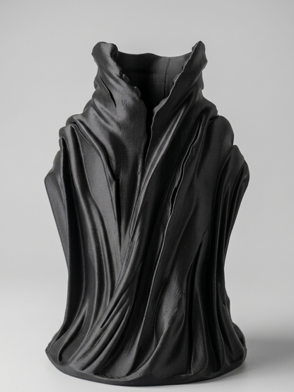 Black sculpture on a gray background