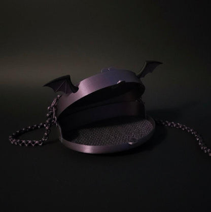 Purple bat-wing mesh purse with 3D-printed bat ears, black trim, and matching chain strap.