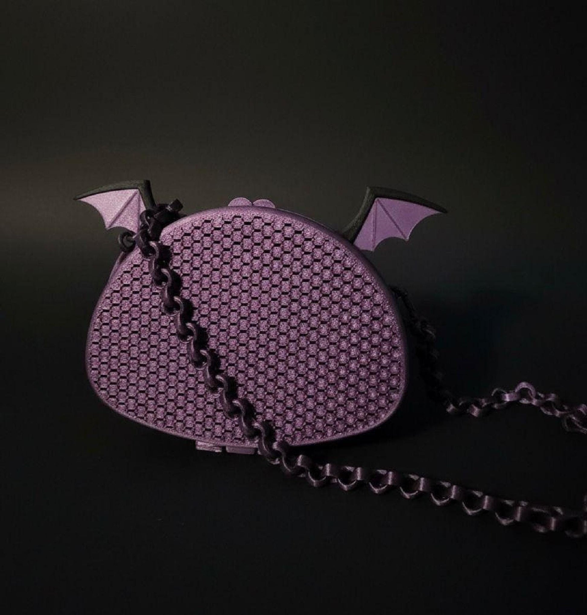 Purple bat-wing mesh purse with 3D-printed bat ears, black trim, and matching chain strap.